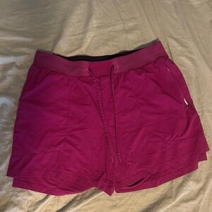 Men’s magenta, purple workout shorts
